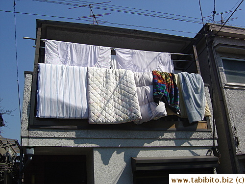 Airing futon covers(top row) and futons on a sunny day, a common thing to do in Japan