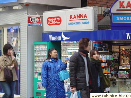 Girl giving out free cigarettes