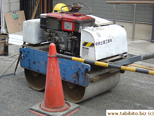 Tiniest trench roller ever, the normal-size traffic cone gives the sense of scale