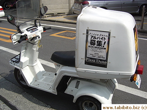 This motorbike's engine is still running with the driver nowhere in sight