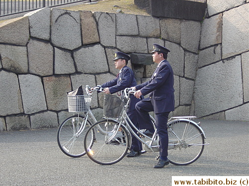 Cops on bike patrol the ground of the Imperial Garden in Tokyo