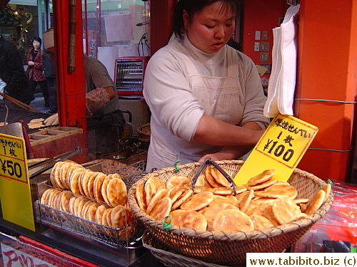 Woman selling freshly-made rice crackers