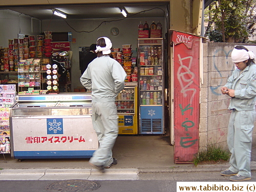 These two workers look like they need a drink or snack