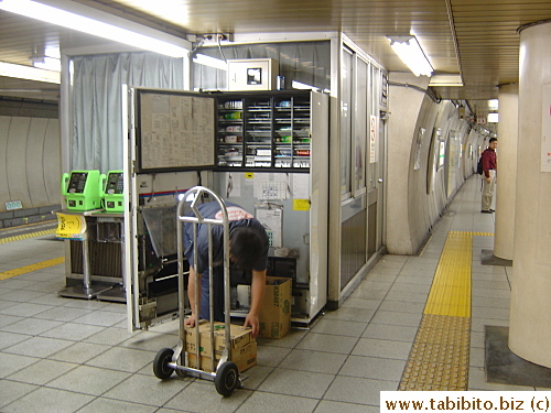 Man stocking up a vending machine