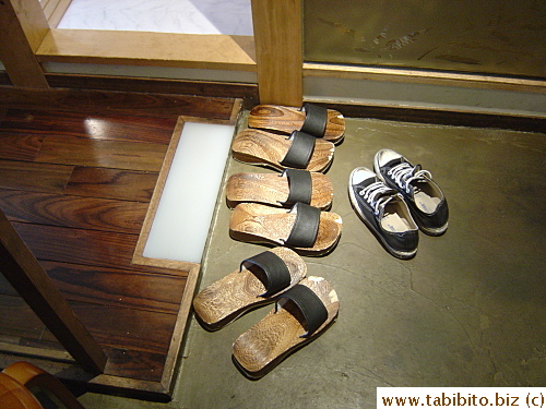 Wooden sandals provided for patrons who use their special rooms where shoes are not allowed