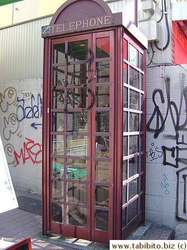 Graffiti artists have somewhat spared this old-fashioned phone booth in Shimokitazawa