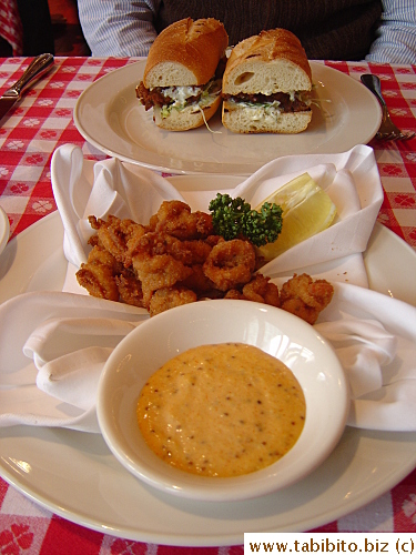  Popcorn shrimp with creole sauce, (front) and fried oyster sandwich, that also included a bowl of clam chowder 