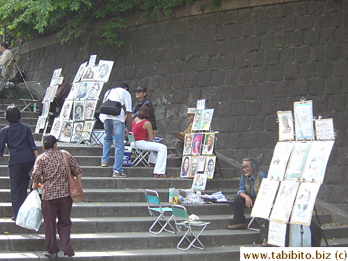 Artists selling their talent on the steps of Ueno Park