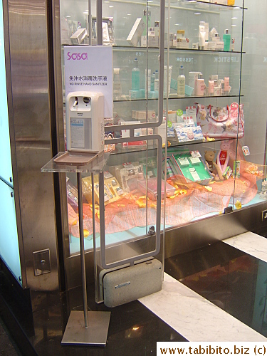 Disinfectant liquid dispenser in a drug store