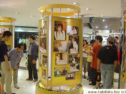 People checking out Michelle Yeoh's photos