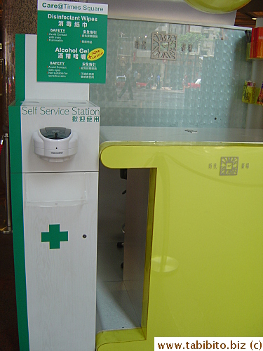 This sanitizing station at Times Square comes complete with alcohol gel and disinfectant wipes