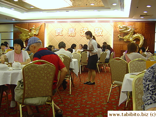 Traditional decorations in a yum cha restaurant: Pheonix and Dragon.  They symbolize woman and man in a wedding reception dinner which is commonly held in yum cha restaurants
