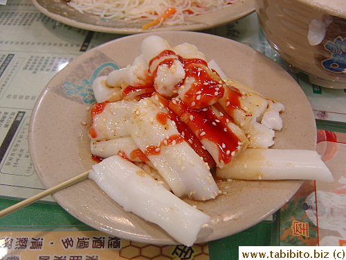 Typical side dish for breakfast:steamed rolls made of rice flour, eaten with a sweet sauce and toasted sesame seeds. I love it