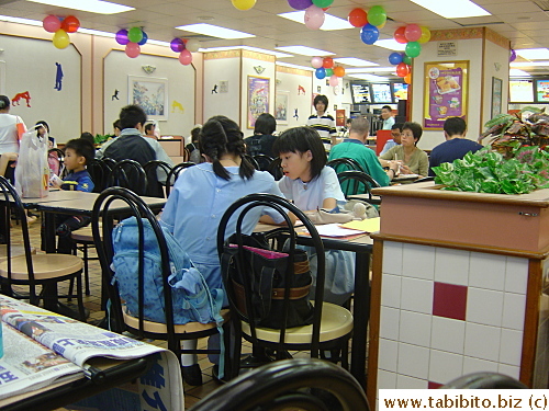 Primary school students study at McDonald's