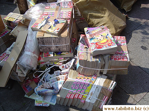Comic books thrown out on the street to be collected as garbage
