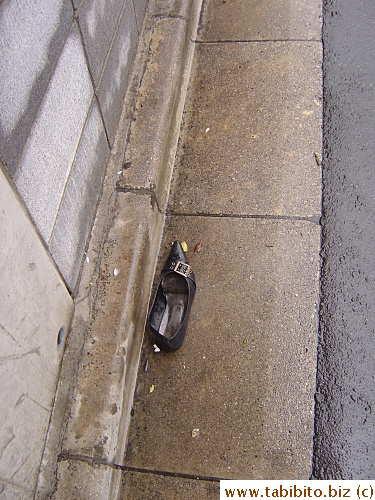 Why's there a shoe in the middle of a street? Who walks around with one shoe?