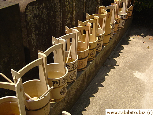Buckets found in the cemetery. They are used by families to carry water to fill the vases on the tombstones and to cleanse the wooden planks
