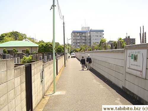 This street, flanked by cemeteries, will be pretty spooky to walk at night