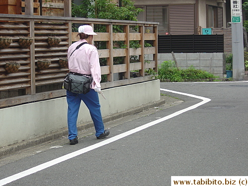 She turns away once she sees me taking her picture.  Sorry ma'am