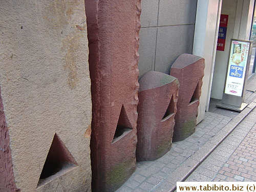 Stone sculptures in a back alley in Shibuya.  Drunk people might mistake them for urinals at night