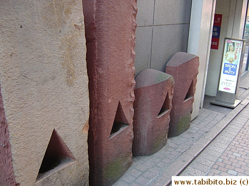 Stone sculptures in a back alley in Shibuya. Drunk people might mistake them for urinals at night