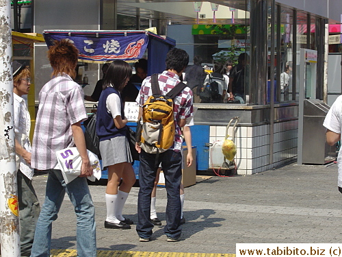A vest may be better than a sweater, but it still doesn't make the girl any cooler under the 31C sun