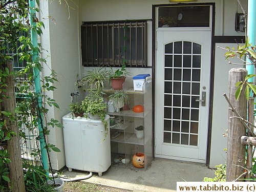 This old plastic Jack-o'-latern has been sitting in front of this house in our neighborhood for ages