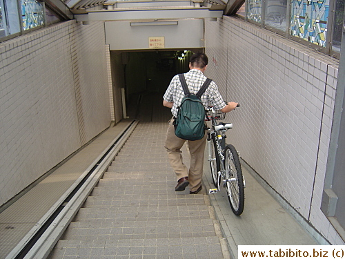 KL parks his bike in an underground bicycle parking garage before taking a train to work