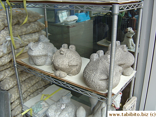 Frogs carved in limestone