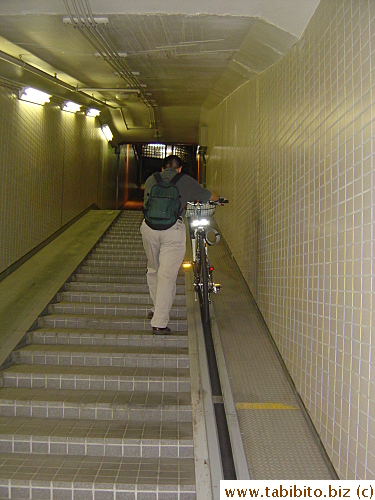 The conveyor belt beside the stairs automatically starts running once you place the bike on it, making it very easy to carry the bike up and out of the garage