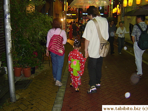 Another kid in yukata and wooden sandals