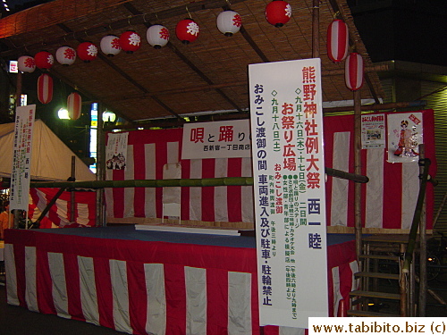 Stand for the festival. The info on the white banner tells people where the parade takes place