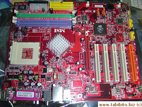 The new motherboard's red.  Looks very complicated to me