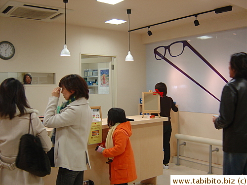 Glasses are being picked up from the counter in the basement