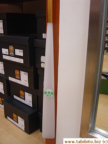 The shoehorns in ABC shoe store, a franchised shop here, have this sign on them. It says: germicide is used (in this shoehorn)