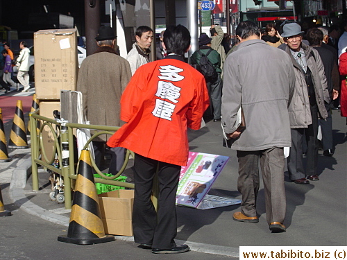 Takeya staff giving out flyers on the street
