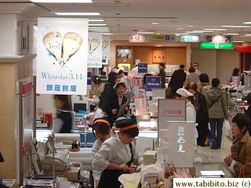 The food section in the basement of Isetan Dept Store in Shinjuku promotes White Day with posters hanging from the ceiling