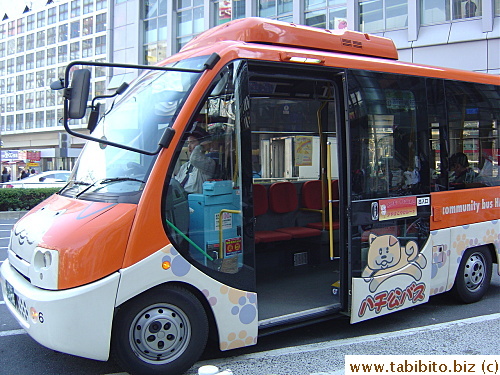 The bus driver waits for passengers at the bus stop in Shibuya