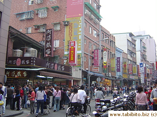 A main street near Dansui River, it's full of food stores and snack shops