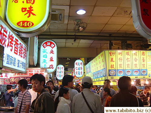 The hawker center is crowded with people looking for a bite to eat