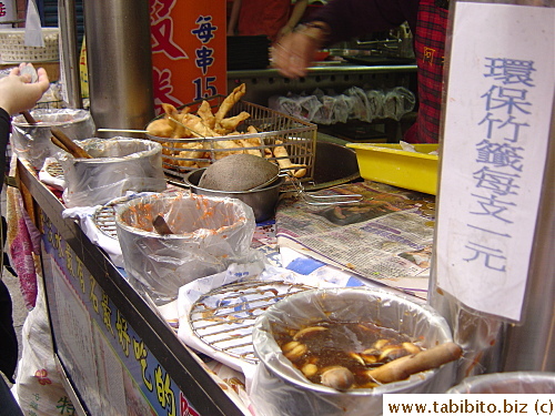 Once you get your shrimp roll, you slap on any sauce you like in one of the containers. I prefer the garlic soy sauce to the sweet chili sauce