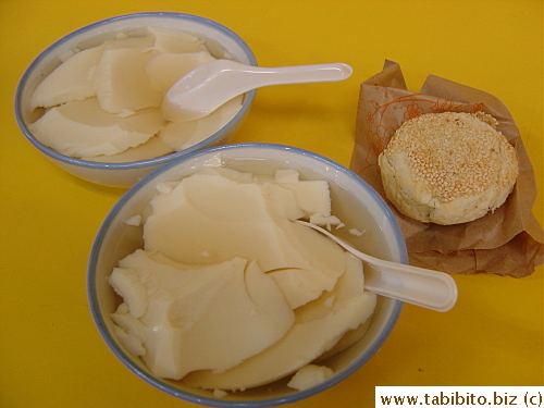 Delicious soft tofu in ginger syrup, and a sweet snack I bought at another stall which tasted badly