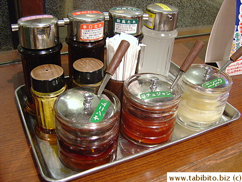 A tray of condiment is set up on every table for diners to mix their own dipping sauce
