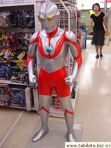 I think Ultraman's costume is cooler than Superman's, at least he's not wearing a silly brief; his biker shorts are more hip. The blue thing on his chest indicates his power is up before he needs to recharge himself (imagine THAT happening while he's kicking butt!). In HK, Ultraman has a nickname called 