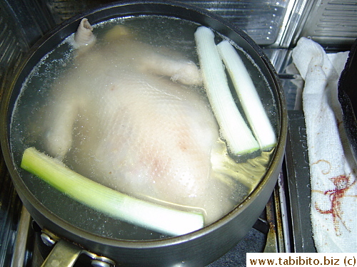 The skin of the chicken looks cooked seconds after going into the stock