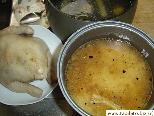 When the stock is just lukewarm, the chicken should be cooked. Test doneness by inserting a stick in the thigh and clear juice should run out. The flavorful stock is used to cook the rice. (I threw in a piece of coriander root for extra flavor)