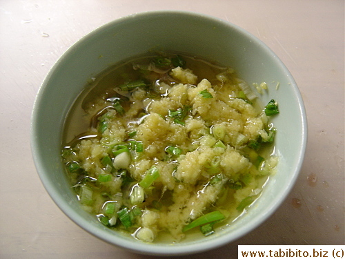 Add salt to the ginger mixture and pour SMOKING hot oil over it ( Make sure the oil is so smoking hot that another minute in the pan will have made it catch on fire). Voila! I present to you the addictively yummy ginger and onion dipping sauce/oil