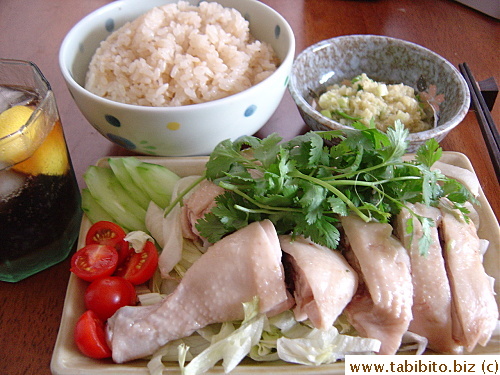 Deliriously delicious Hainenese Chicken Rice.  Instead of a traditional bowl of soup, we had coke with lemon