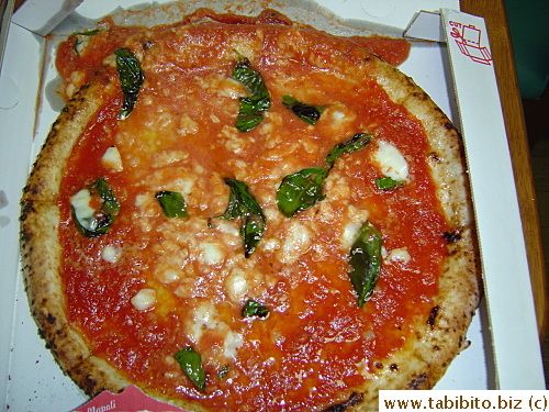 Overflowing pizza sauce spilled out during transportation made a third of the pizza crust completely soggy, and yucky