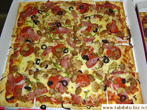 Super supreme pizza on a crust as crispy as a cracker